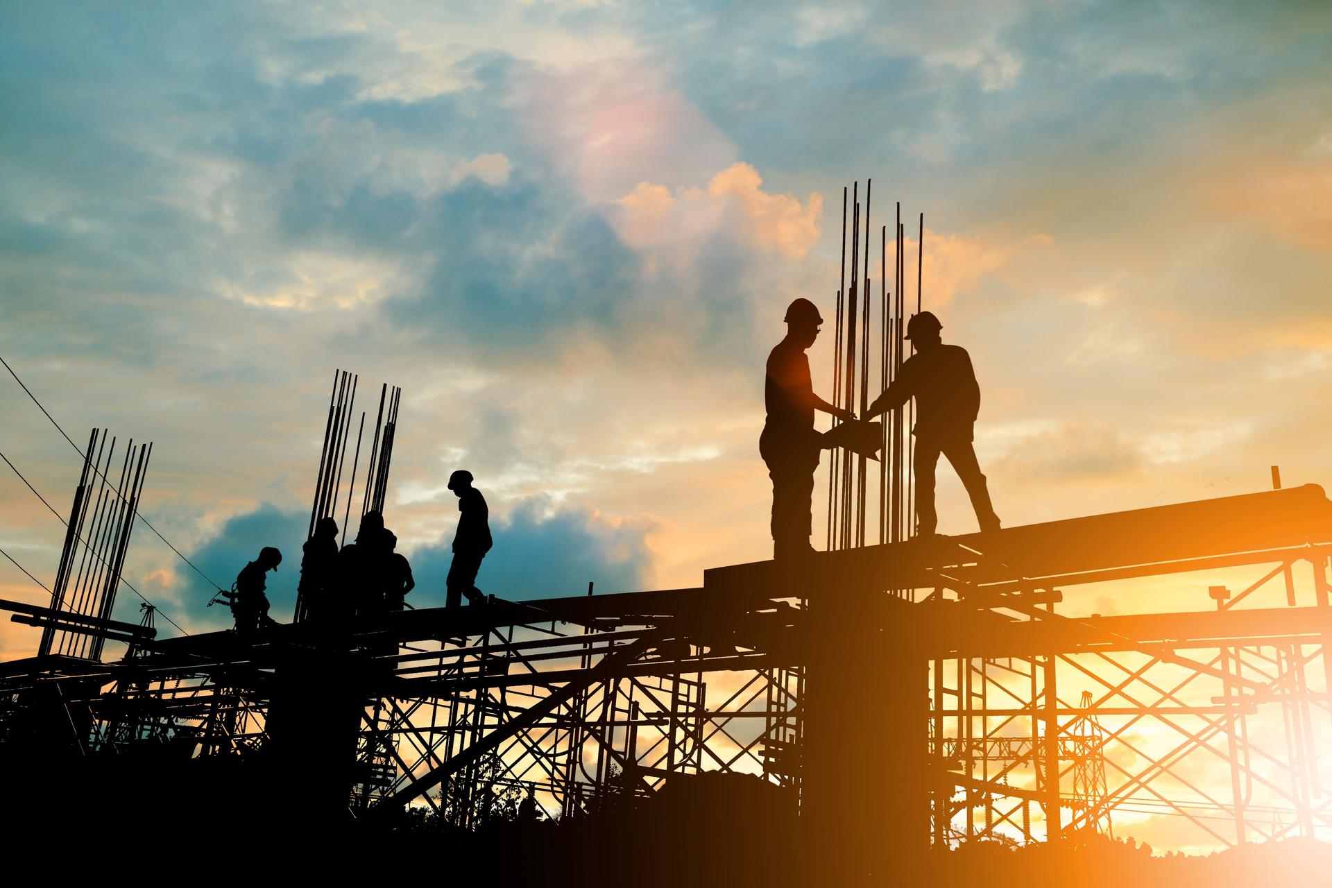 Silhouette of engineer and construction team working at site over blurred background sunset pastel for industry background with Light fair.Create from multiple reference images together.